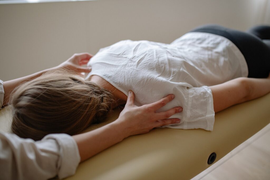 Common Physio Treatments and Their Benefits- Hands of physiotherapist treating a Girl